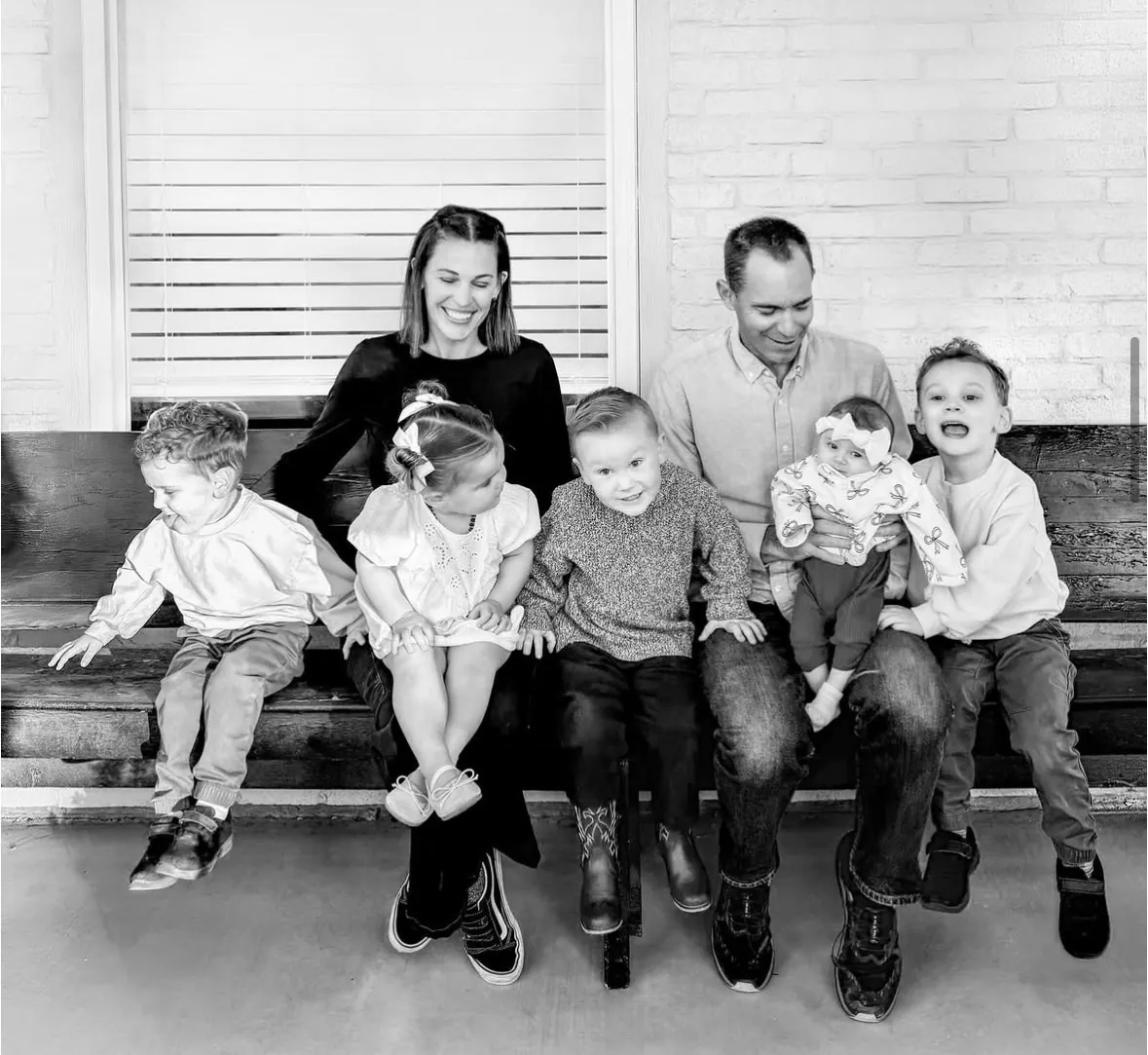Aaron Langston and his family on a porch bench